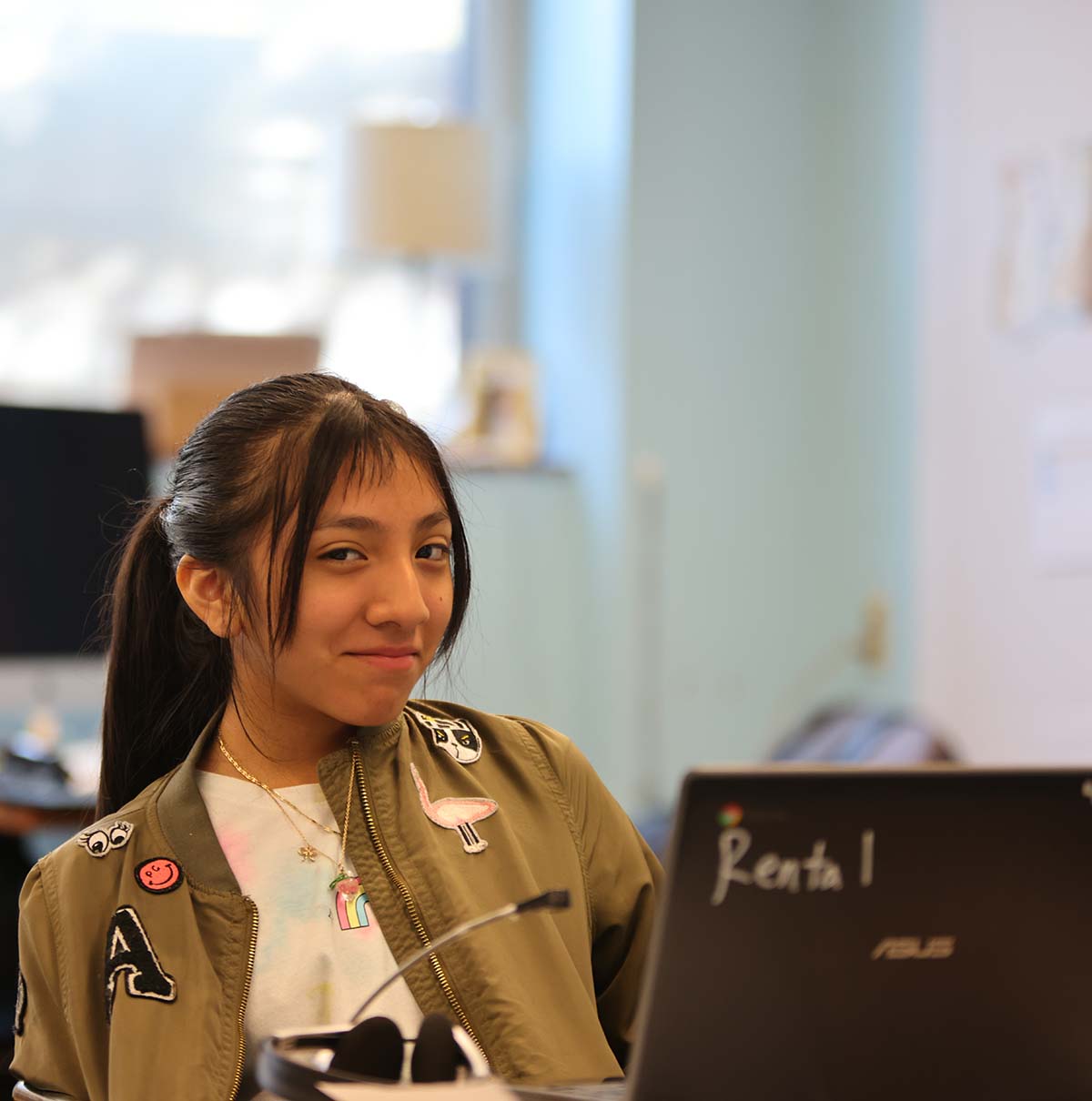 Student drawing in a classroom.